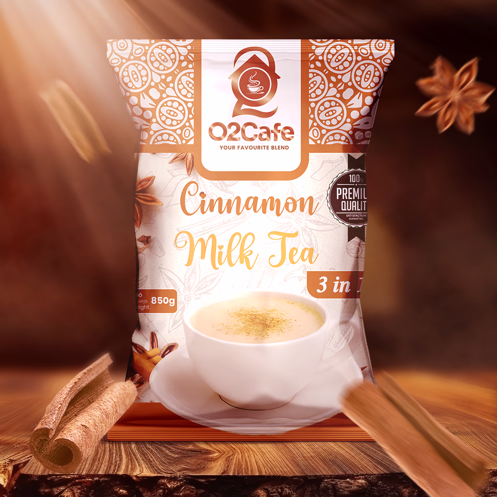 An 850g packet of O2 Cafe Cinnamon 3-in-1 milk tea resting on a rustic wooden table with cinnamon sticks and star anise, expanding our premium range of milk tea premixes in Sri Lanka